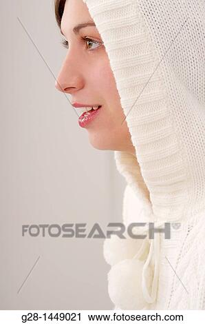 Young smiling woman in white woolen hood on her head View Large Photo Image Stock Image - Young smiling woman in white woolen hood on her head. Fotosearch