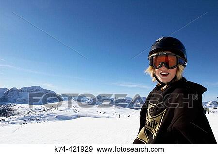 young snowboarder with mountains in background View Large Photo Image Stock Photo - young snowboarder with mountains in background. Fotosearch