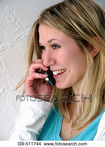 Young student talking on her cell phone View Large Photo Image Picture - Young student talking on her cell phone. Fotosearch