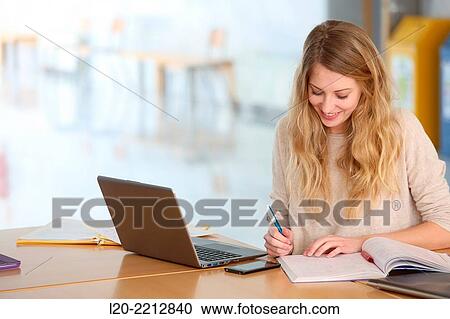 Stock Image - Young students at campus. Fotosearch