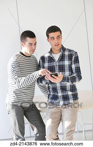 Young students using smartphone View Large Photo Image Stock Photograph - Young students using smartphone. Fotosearch