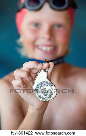 Young swimmer with his medal View Large Photo Image Stock Image - Young swimmer with his medal. Fotosearch