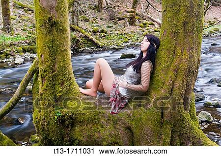 Young teen in the forest, long exposure tripod shot View Large Photo Image Stock Image - Young teen in the forest, long exposure tripod shot. Fotosearch