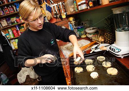 Young teenage girl making home made scones in the kitchen View Large Photo Image Picture - Young teenage girl making home made scones in the kitchen. Fotosearch