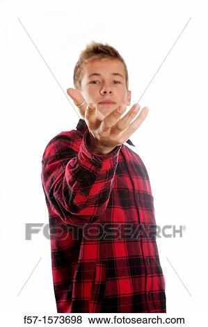 Young teenage man beckoning View Large Photo Image Stock Photo - Young teenage man beckoning. Fotosearch