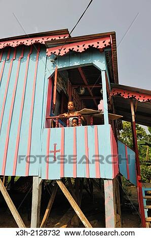 Young teenager on the veranda of her home, village of Praia das Conchas, in the northern part of Sao Tome Island, Republic of Sao Tome and Principe, Africa. View Large Photo Image Stock Image - Young teenager on the veranda of her home, village of Praia das Conchas, in the northern part of Sao Tome Island, Republic of Sao Tome and Principe, Africa.. Fotosearch