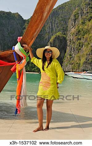 Stock Image - Young thai woman on the beach, Maya Bay, Koh Phi Phi Lee island Krabi, Thailand, Asia. Fotosearch