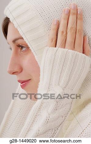 Young thoughtful woman in white woolen hood on her head, with her hands on her ears View Large Photo Image Stock Image - Young thoughtful woman in white woolen hood on her head, with her hands on her ears. Fotosearch