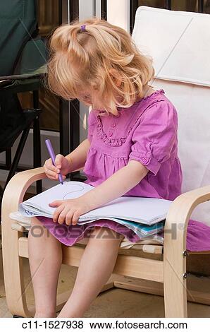 Young three year old girl drawing on paper with pen View Large Photo Image Stock Photo - Young three year old girl drawing on paper with pen. Fotosearch