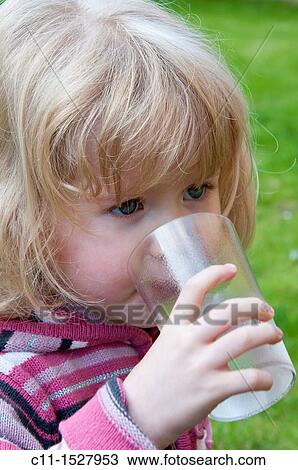 Young three year old girl drinking water View Large Photo Image Stock Image - Young three year old girl drinking water. Fotosearch