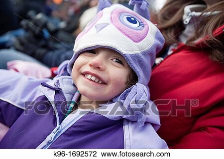 Stock Image - young toddler in purple hat. Fotosearch