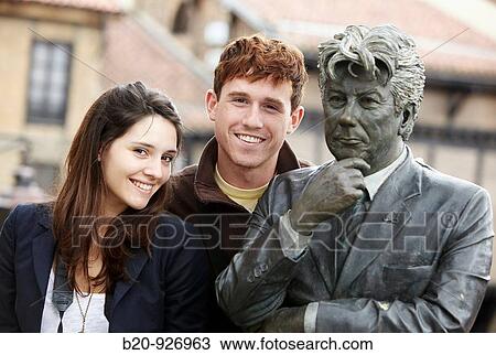 Young tourist couple and statue dedicated to Ken Follet, El Portal? n in background, Medieval town, Vitoria-Gasteiz, Alava, Basque Country, Spain View Large Photo Image Stock Image - Young tourist couple and statue dedicated to Ken Follet, El Portal? n in background, Medieval town, Vitoria-Gasteiz, Alava, Basque Country, Spain. Fotosearch
