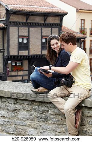 Young tourist couple. El Portal? n, Medieval town, Vitoria, Gasteiz, Alava, Basque Country, Spain View Large Photo Image Stock Photo - Young tourist couple. El Portal? n, Medieval town, Vitoria, Gasteiz, Alava, Basque Country, Spain. Fotosearch