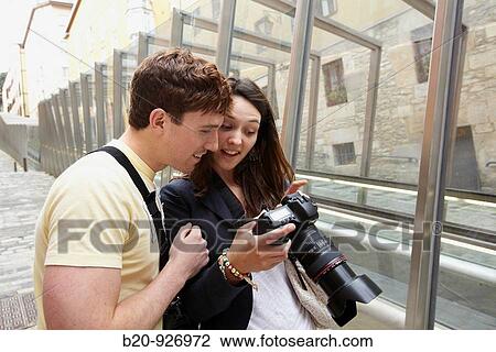 Young tourist couple. Escalator, Old town, Vitoria-Gasteiz, Alava, Basque Country, Spain View Large Photo Image Stock Image - Young tourist couple. Escalator, Old town, Vitoria-Gasteiz, Alava, Basque Country, Spain. Fotosearch