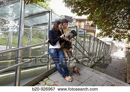 Young tourist couple. Escalator, Old town, Vitoria-Gasteiz, Alava, Basque Country, Spain View Large Photo Image Stock Photo - Young tourist couple. Escalator, Old town, Vitoria-Gasteiz, Alava, Basque Country, Spain. Fotosearch