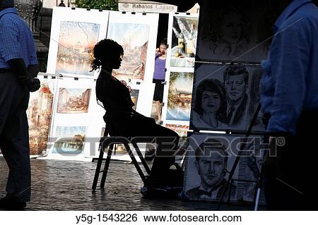 young tourist posing for portrait artist in piazza navona square rome View Large Photo Image Stock Photograph - young tourist posing for portrait artist in piazza navona square rome. Fotosearch