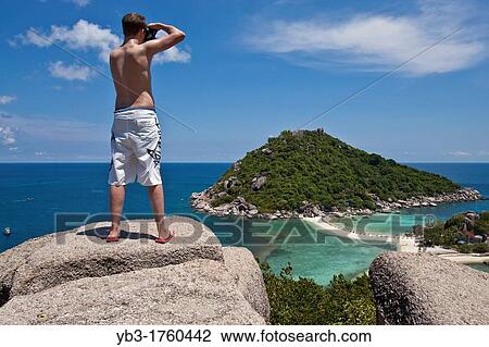 Young tourist taking a photograph of Nang Yuan beach, Ko Tao, Thailand View Large Photo Image Stock Image - Young tourist taking a photograph of Nang Yuan beach, Ko Tao, Thailand. Fotosearch