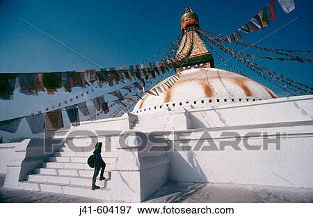 Young trekker at Bhodnath Temple, the largest Buddhist Stupa in the world. Kathmandu. Nepal View Large Photo Image Stock Photo - Young trekker at Bhodnath Temple, the largest Buddhist Stupa in the world. Kathmandu. Nepal. Fotosearch