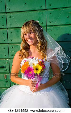 Young wedding bride smiling View Large Photo Image Stock Image - Young wedding bride smiling. Fotosearch