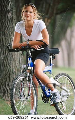 Young woman 20 years old with bike View Large Photo Image Stock Image - Young woman 20 years old with bike. Fotosearch