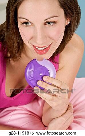 Young woman about to breeze her inhaler to treat asthma problems View Large Photo Image Stock Photography - Young woman about to breeze her inhaler to treat asthma problems. Fotosearch