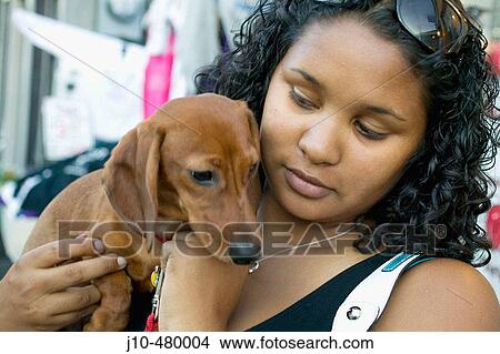 Young woman age 21 with dachshund dog puppy, Rockport, Massachusetts. USA. View Large Photo Image Picture - Young woman age 21 with dachshund dog puppy, Rockport, Massachusetts. USA.. Fotosearch