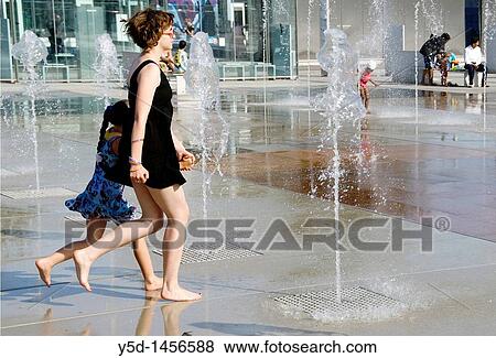 young woman and little girl running between fountains in front of the Palace of Nations, Geneva, Switzerland View Large Photo Image Stock Photo - young woman and little girl running between fountains in front of the Palace of Nations, Geneva, Switzerland. Fotosearch