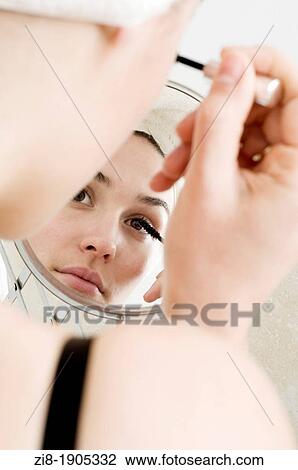 Young woman apllying make-up View Large Photo Image Stock Image - Young woman apllying make-up. Fotosearch