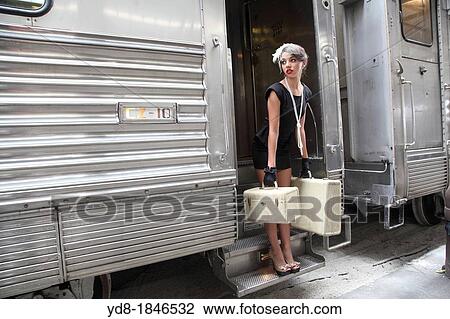 Young woman arriving at the train station of the Gold Coast Railroad Museum, Miami, Florida, USA View Large Photo Image Stock Image - Young woman arriving at the train station of the Gold Coast Railroad Museum, Miami, Florida, USA. Fotosearch