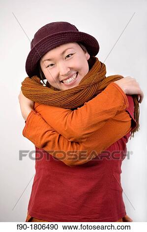 Young woman Asian model poses in studio View Large Photo Image Stock Image - Young woman Asian model poses in studio. Fotosearch