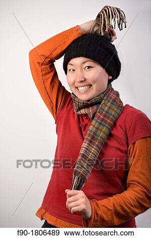 Young woman Asian model poses in studio View Large Photo Image Stock Photo - Young woman Asian model poses in studio. Fotosearch