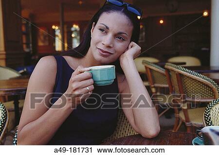 Young woman at cafe View Large Photo Image Stock Image - Young woman at cafe. Fotosearch