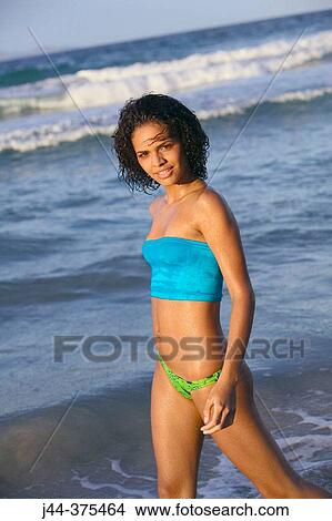 Young woman at the beach View Large Photo Image Picture - Young woman at the beach. Fotosearch