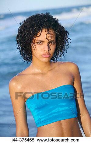 Young woman at the beach View Large Photo Image Stock Photography - Young woman at the beach. Fotosearch