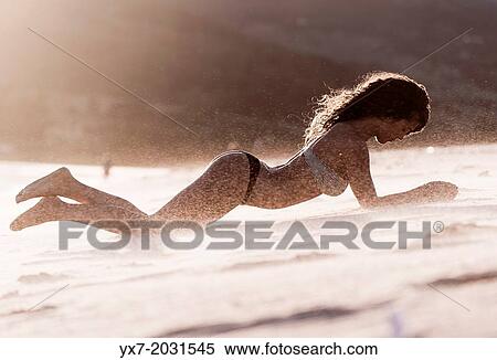 Young woman at the beach. View Large Photo Image Stock Photography - Young woman at the beach.. Fotosearch