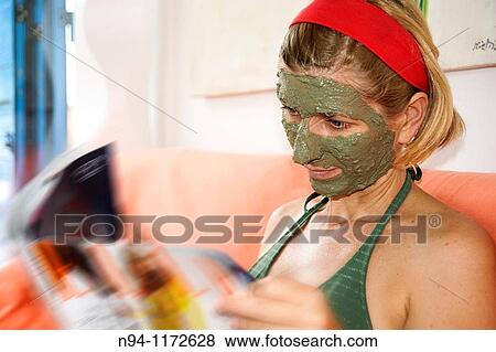 Stock Photo - Young woman at the time of relaxation. Using the free time to their personal care.. Fotosearch
