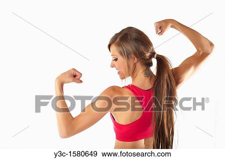 Stock Photo - Young woman body building. Fotosearch