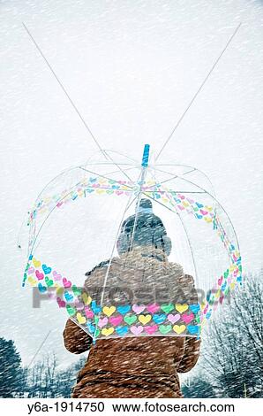 Young woman caught up in a snow storm View Large Photo Image Stock Image - Young woman caught up in a snow storm. Fotosearch