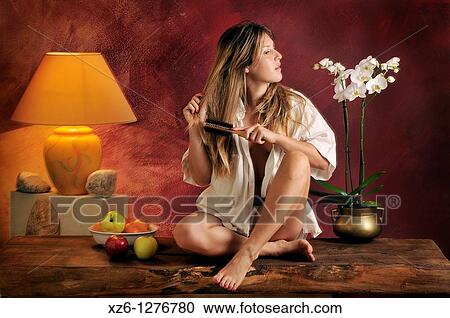 young woman combing View Large Photo Image Stock Image - young woman combing. Fotosearch