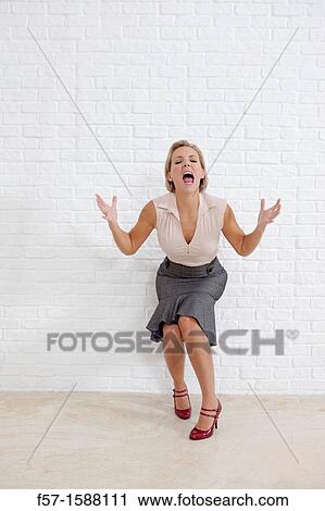 Young woman conveying anger View Large Photo Image Stock Image - Young woman conveying anger. Fotosearch