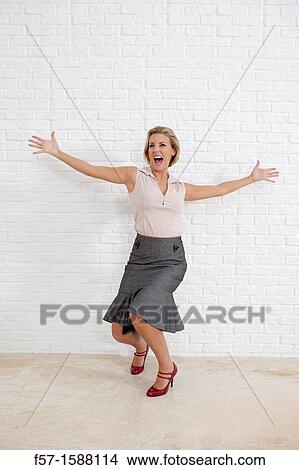 Young woman conveying extreme joy View Large Photo Image Picture - Young woman conveying extreme joy. Fotosearch