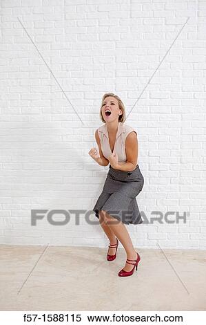 Young woman conveying extreme joy View Large Photo Image Stock Photography - Young woman conveying extreme joy. Fotosearch