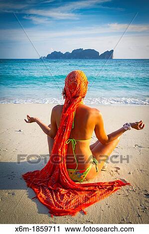Young woman doing yoga on the beach Long beach Phi Phi Don island Krabi province, Andaman Sea, Thailand View Large Photo Image Stock Image - Young woman doing yoga on the beach Long beach Phi Phi Don island Krabi province, Andaman Sea, Thailand. Fotosearch