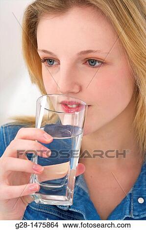 Picture - Young Woman drinking glass of water. Fotosearch