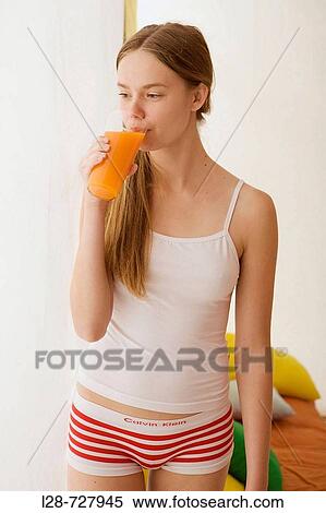 young woman drinking juice View Large Photo Image Stock Photography - young woman drinking juice. Fotosearch