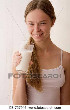 Stock Photograph - young woman drinking milk. Fotosearch
