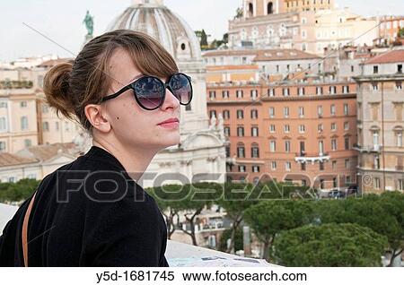 Stock Photography - Young woman during sightseeing in Rome, Italy. Fotosearch