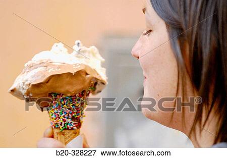 Young woman eating ice cream. Rome. Italy View Large Photo Image Stock Photo - Young woman eating ice cream. Rome. Italy. Fotosearch