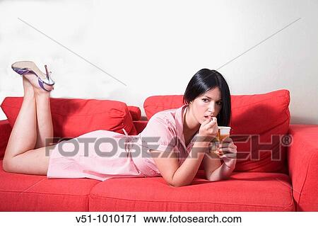 Young woman eating ice cream View Large Photo Image Stock Image - Young woman eating ice cream. Fotosearch