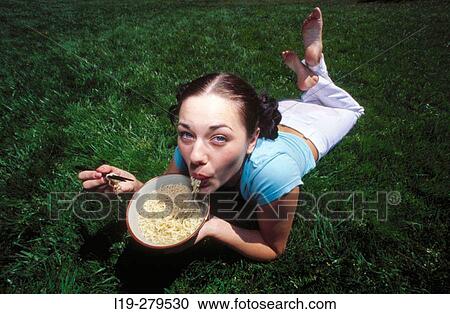 young woman eating noodles View Large Photo Image Stock Image - young woman eating noodles. Fotosearch